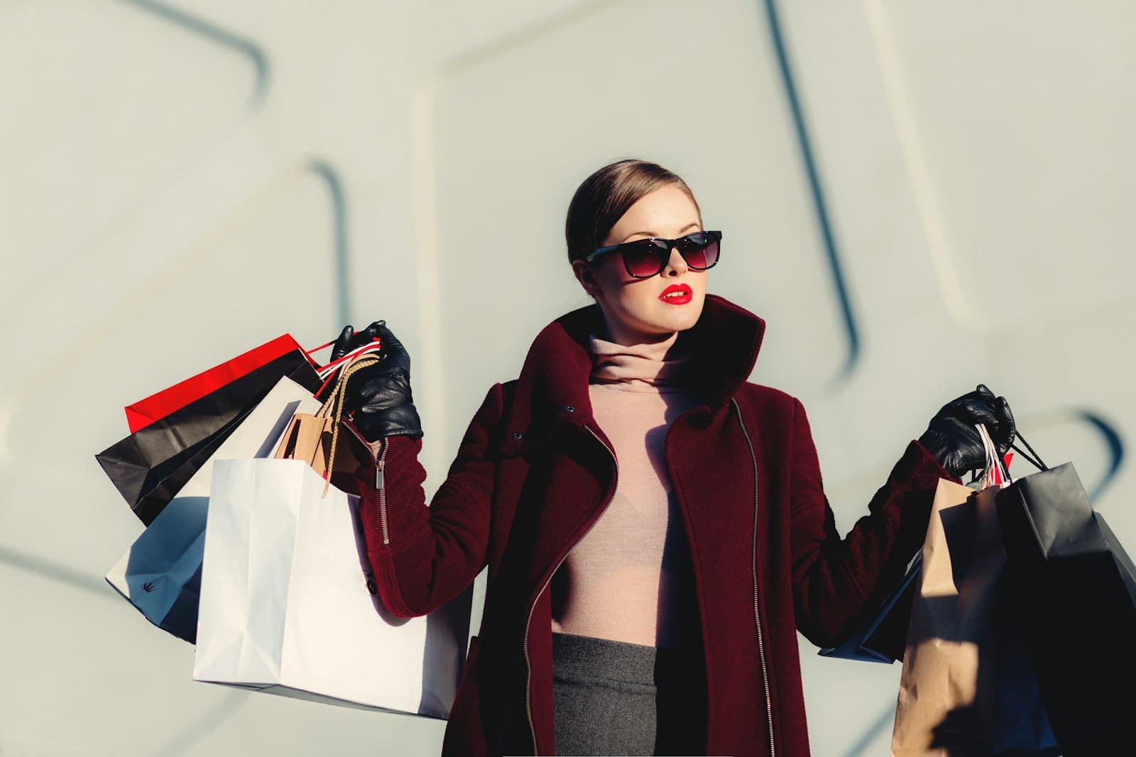 A fashion shopper with bags — the traffic a Maria B. storefront has to convert